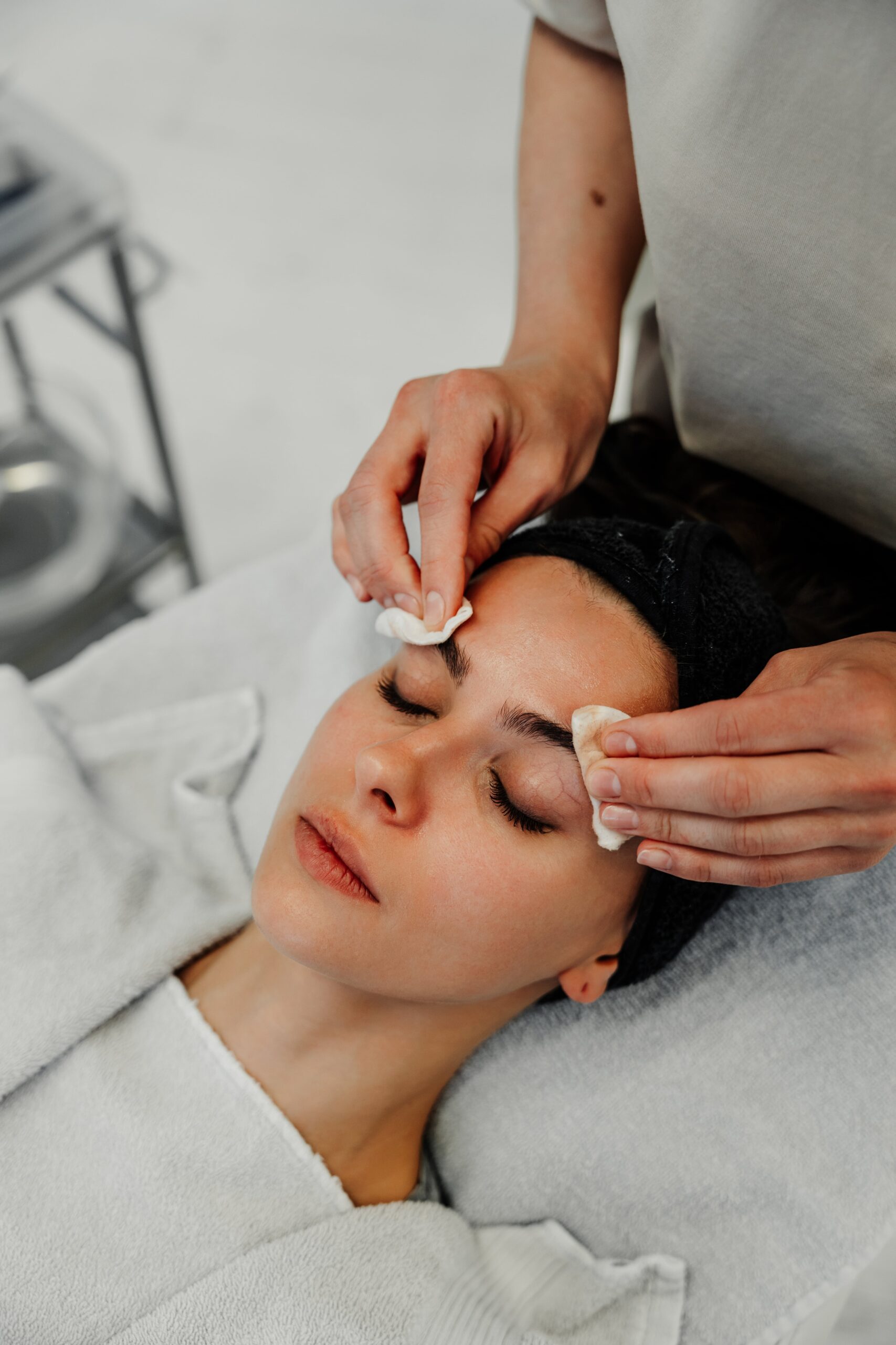 Relaxation During Facial Treatment at Spa in Modern Interior Setting