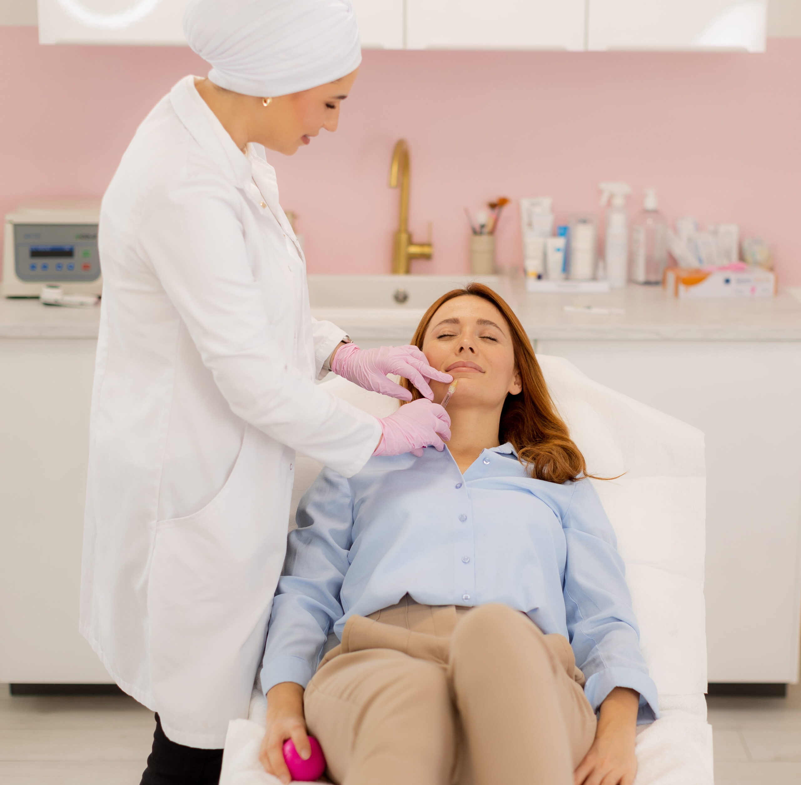 Expertly enhancing beauty through lip filler treatment in a serene clinic setting