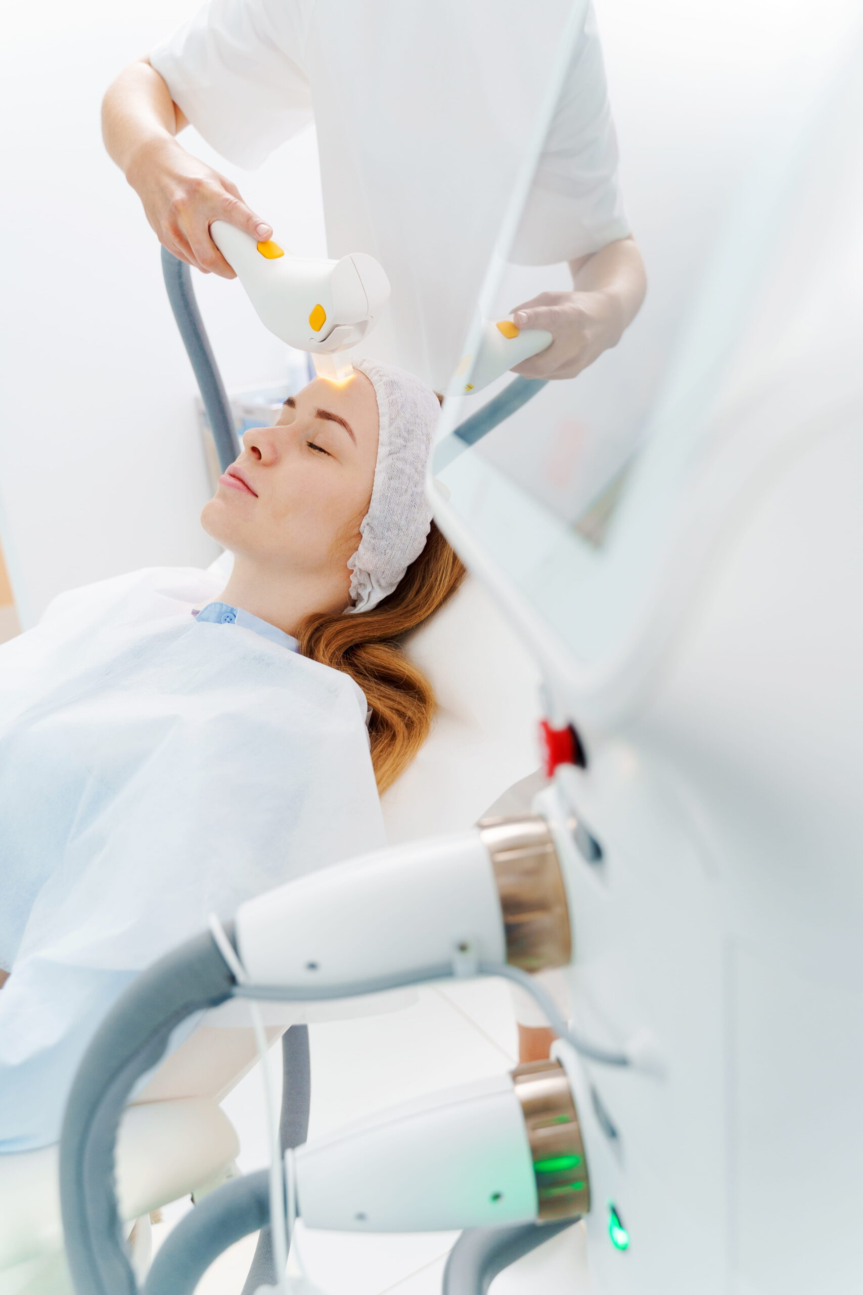 Woman Receiving Light Therapy Treatment in Clinic