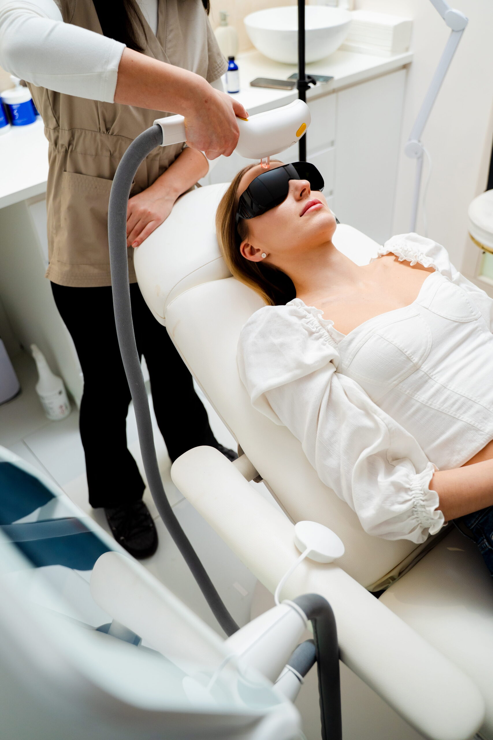 Woman Receiving Laser Treatment in a Medical Clinic